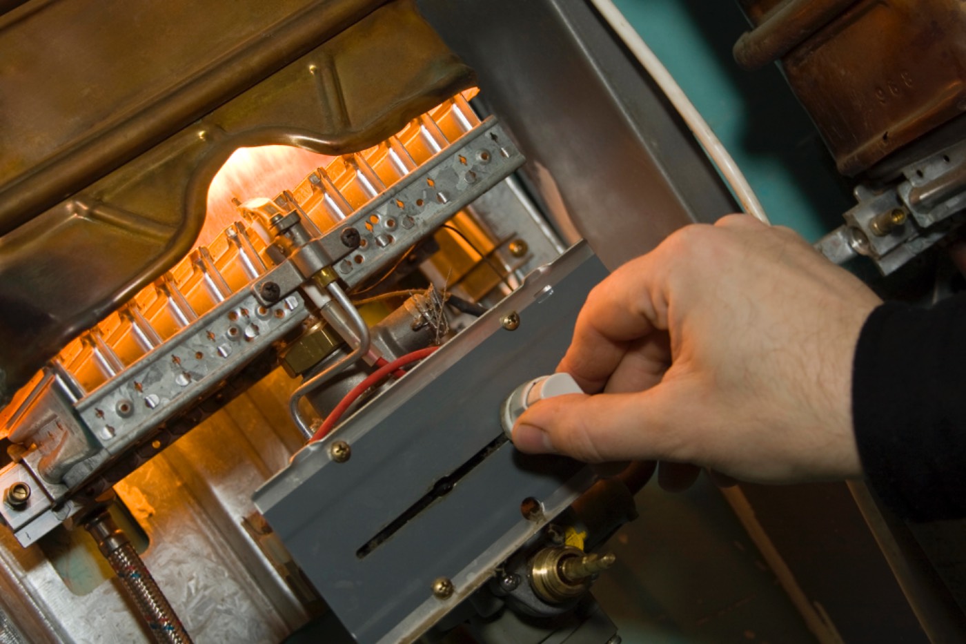 Close-up of a Hixon technician servicing a gas furnace near Braselton, GA